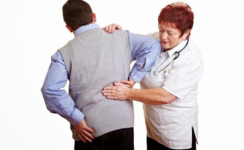 examination of the patient by a doctor for back pain